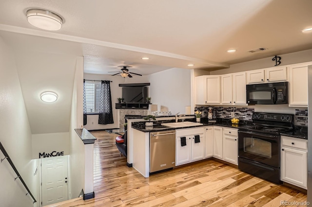 8751 Pearl St Unit J3, Thornton, CO 80229 - kitchen with black appliances, white cabinetry, and recessed lighting