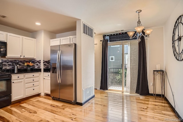 8751 Pearl St Unit J3, Thornton, CO 80229 - kitchen with black appliances, white cabinets, light wood finished floors, and recessed lighting