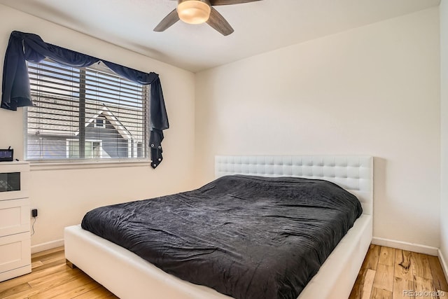 8751 Pearl St Unit J3, Thornton, CO 80229 - bedroom with wood finished floors and ceiling fan