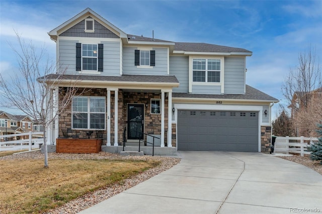 view of front of home with a garage and a front yard