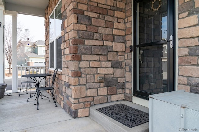 view of exterior entry featuring a porch