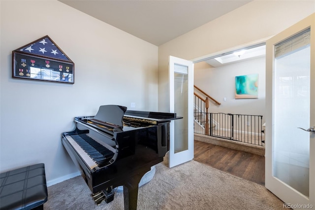 miscellaneous room with french doors and carpet