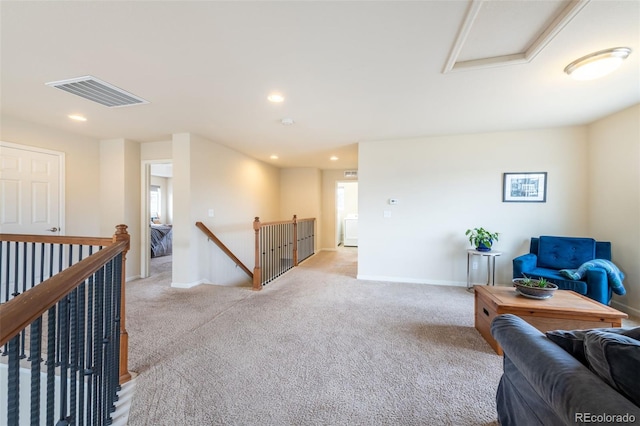 sitting room featuring light colored carpet