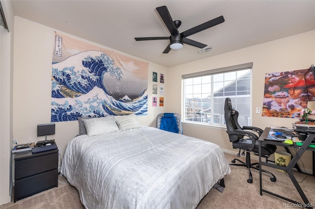 bedroom featuring light carpet and ceiling fan