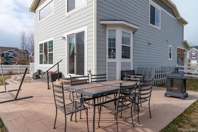 view of patio featuring an outdoor fire pit