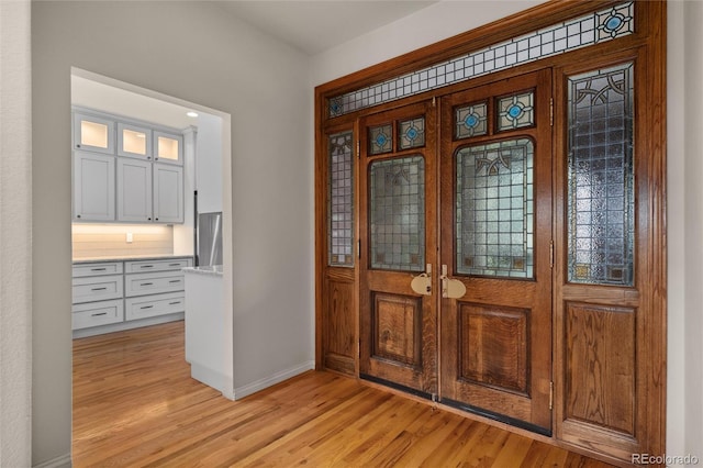 entryway with light hardwood / wood-style floors