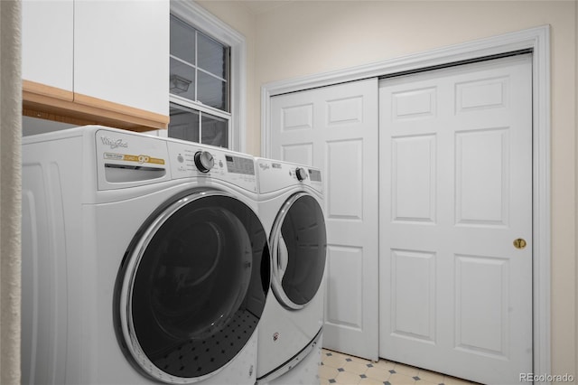 washroom with washer and dryer