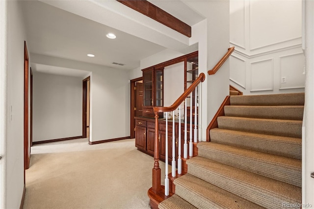 stairs with carpet flooring