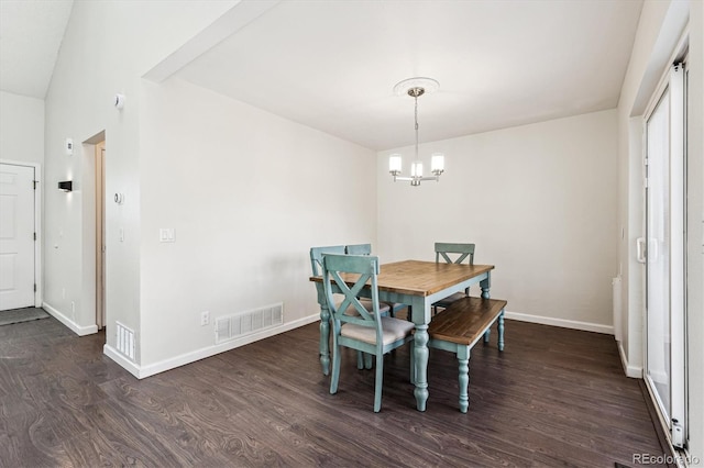 10309 W Fair Ave Unit E, Littleton, CO 80127 - dining room with dark wood-style flooring, a chandelier, and baseboards