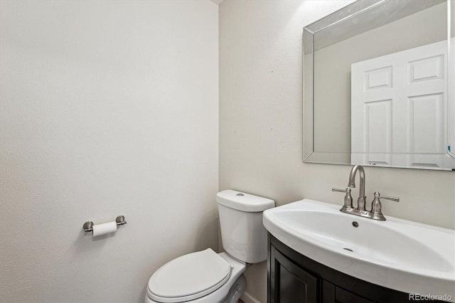 10309 W Fair Ave Unit E, Littleton, CO 80127 - half bath featuring toilet and vanity