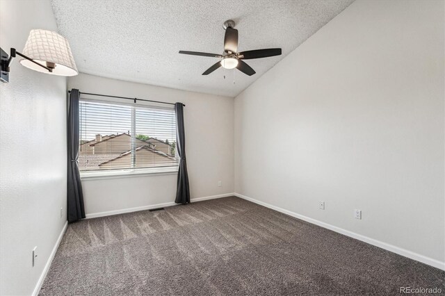 10309 W Fair Ave Unit E, Littleton, CO 80127 - empty room with a textured ceiling, ceiling fan, carpet floors, lofted ceiling, and baseboards