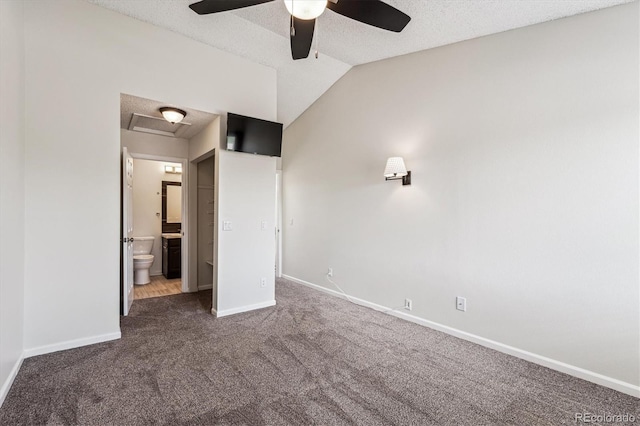 10309 W Fair Ave Unit E, Littleton, CO 80127 - unfurnished bedroom with carpet, baseboards, ensuite bathroom, a textured ceiling, and attic access