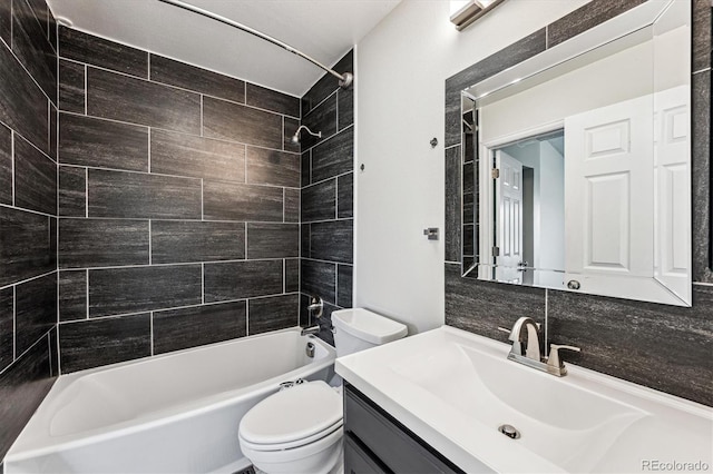10309 W Fair Ave Unit E, Littleton, CO 80127 - bathroom featuring shower / bath combination, toilet, vanity, and backsplash