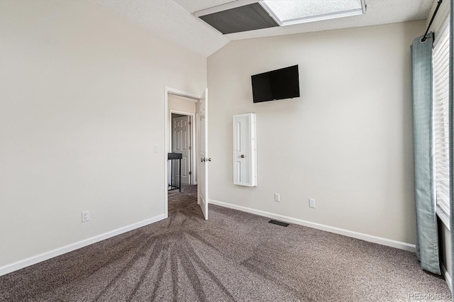 10309 W Fair Ave Unit E, Littleton, CO 80127 - unfurnished bedroom featuring carpet flooring, lofted ceiling, and baseboards