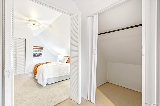 bedroom featuring lofted ceiling, ceiling fan, and carpet flooring