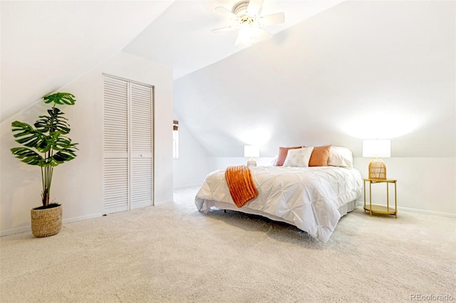 bedroom with ceiling fan, carpet, baseboards, and vaulted ceiling