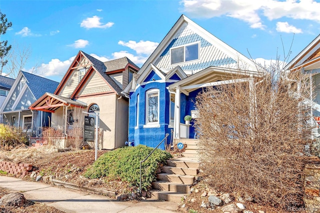 victorian house with stucco siding