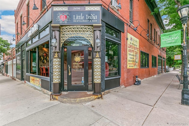 property entrance with brick siding