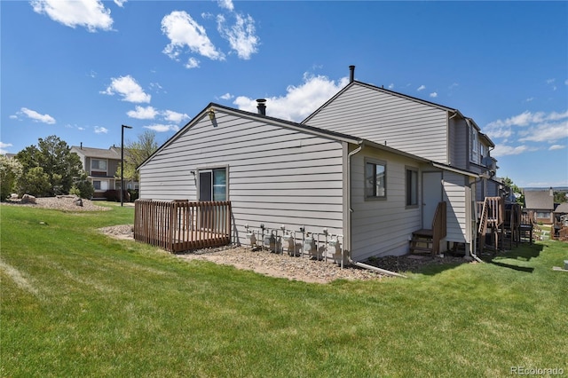 5501 Denmark Ct, Colorado Springs, CO 80918 - rear view of property featuring a yard