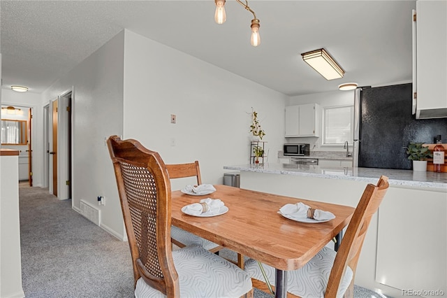 5501 Denmark Ct, Colorado Springs, CO 80918 - dining area featuring light colored carpet
