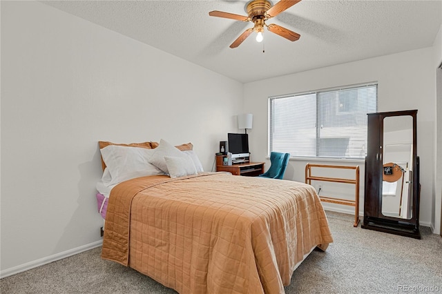 5501 Denmark Ct, Colorado Springs, CO 80918 - carpeted bedroom featuring baseboards, a textured ceiling, and a ceiling fan