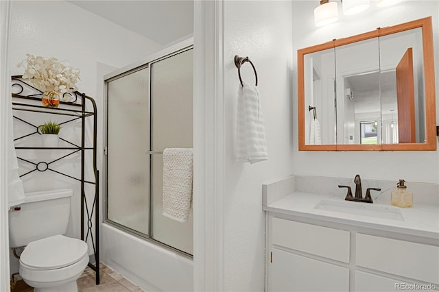 5501 Denmark Ct, Colorado Springs, CO 80918 - full bath featuring toilet, vanity, combined bath / shower with glass door, and tile patterned flooring