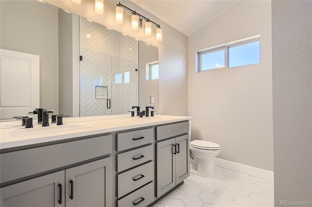 bathroom with lofted ceiling, tile patterned flooring, vanity, a shower with shower door, and toilet