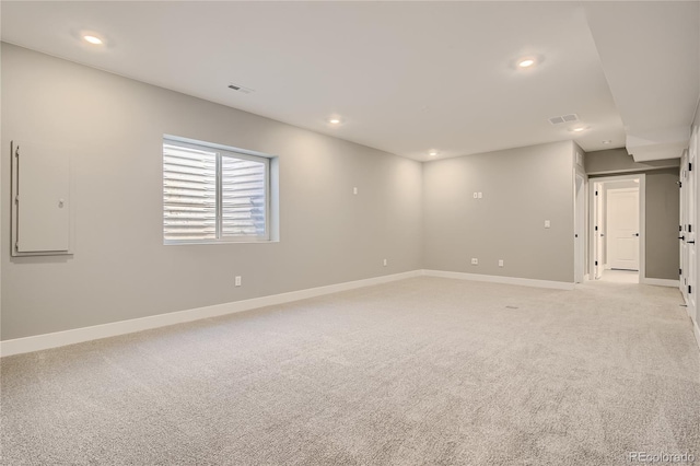 empty room featuring light carpet