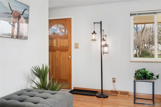 6545 Union St, Arvada, CO 80004 - entryway featuring visible vents and wood finished floors