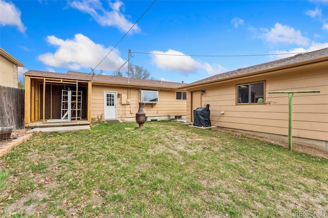 6545 Union St, Arvada, CO 80004 - rear view of property with a lawn and fence
