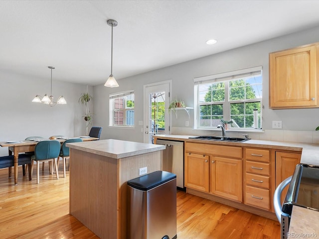 8450 E 29th Ave, Denver, CO 80238 - kitchen with stainless steel appliances, plenty of natural light, a kitchen island, light wood-style floors, and recessed lighting
