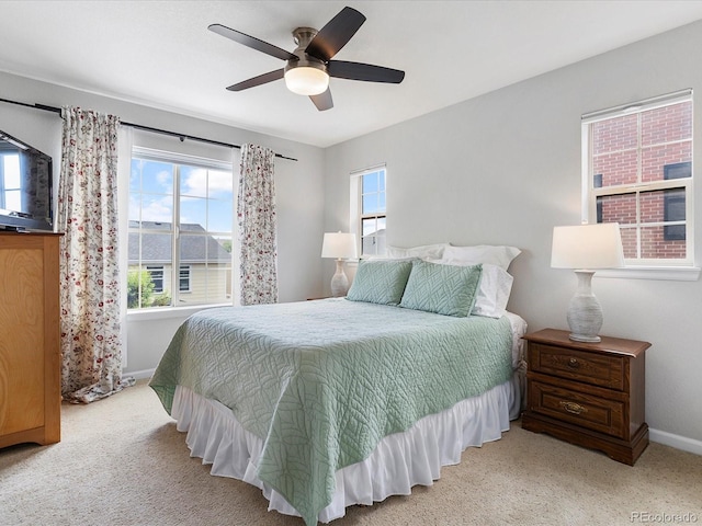 8450 E 29th Ave, Denver, CO 80238 - bedroom with multiple windows, carpet floors, and ceiling fan