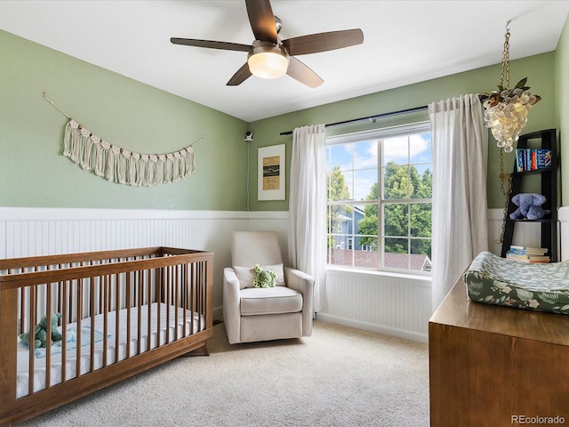 8450 E 29th Ave, Denver, CO 80238 - bedroom featuring carpet floors, a wainscoted wall, and ceiling fan