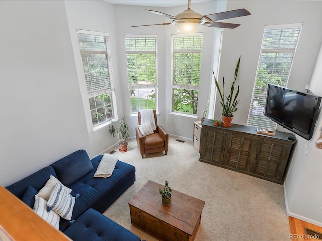 8450 E 29th Ave, Denver, CO 80238 - living room with plenty of natural light, a ceiling fan, and carpet