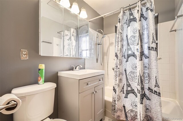 full bathroom featuring shower / tub combo, vanity, and toilet