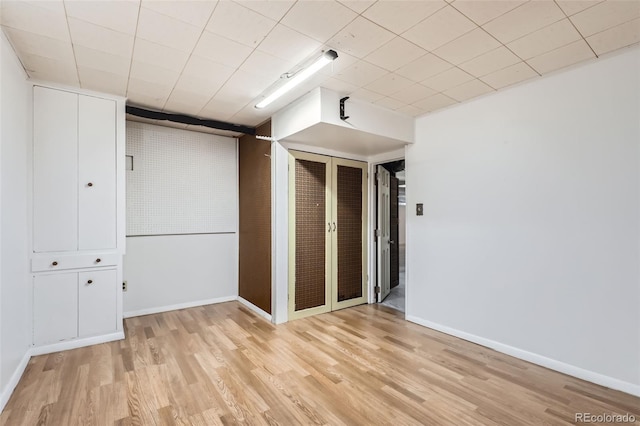 interior space with a closet and light hardwood / wood-style floors