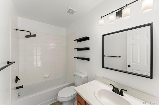 full bathroom featuring vanity, toilet, and tiled shower / bath