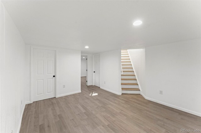 basement featuring light wood-type flooring