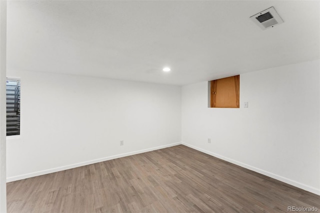 empty room with light hardwood / wood-style flooring