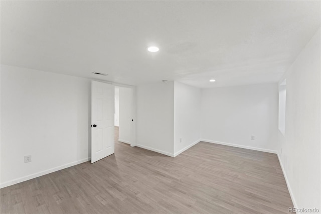 spare room featuring light wood-type flooring