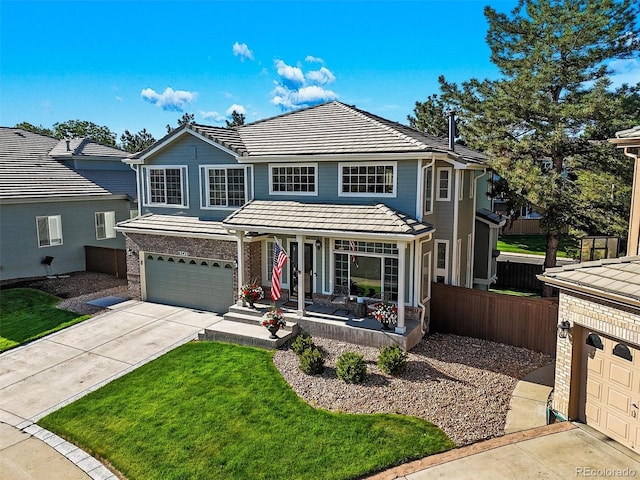 6242 Shea Pl, Highlands Ranch, CO 80130 - traditional-style house featuring a porch, a garage, concrete driveway, and a tiled roof
