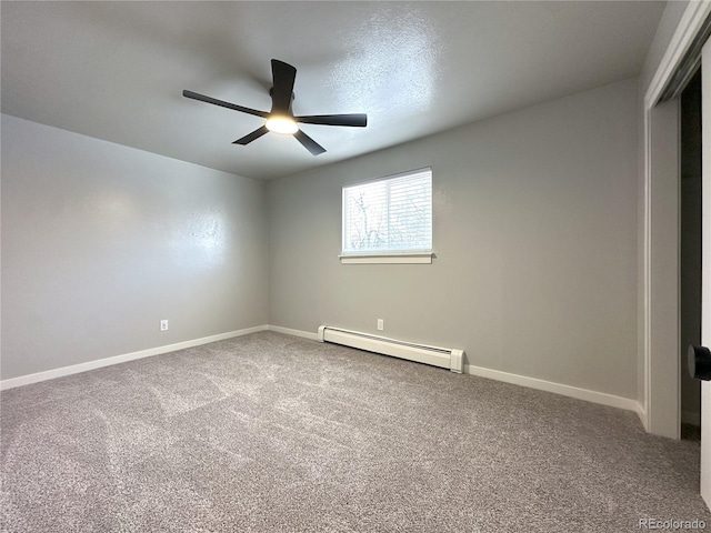 carpeted empty room with a baseboard heating unit and ceiling fan