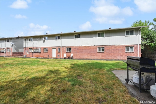 back of house featuring a yard