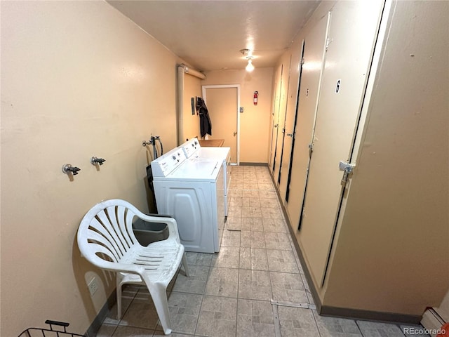 clothes washing area featuring washing machine and dryer