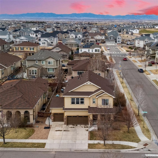 aerial perspective of suburban area with a mountainous background
