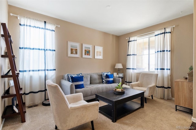 living room with light colored carpet