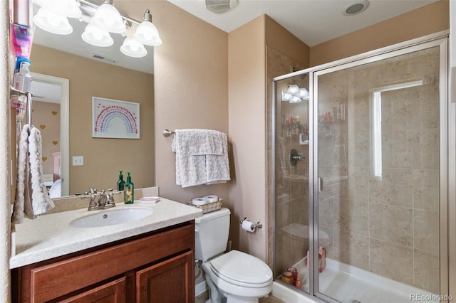 full bath with a shower stall, toilet, and vanity
