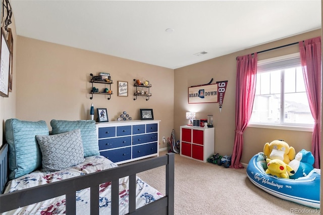 bedroom featuring carpet floors and baseboards