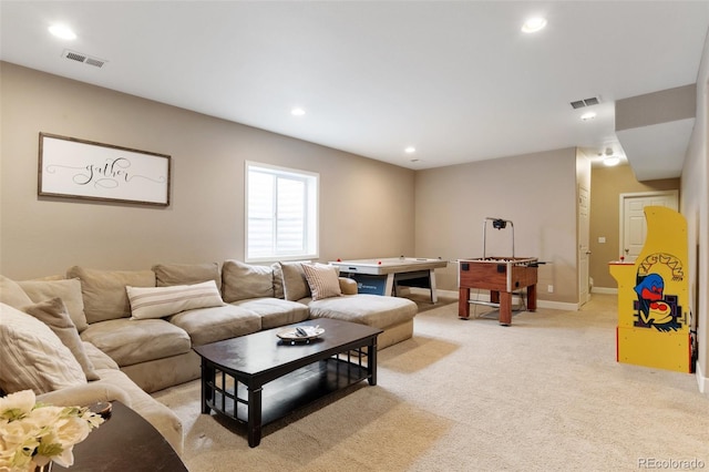 living room featuring recessed lighting, light carpet, and baseboards