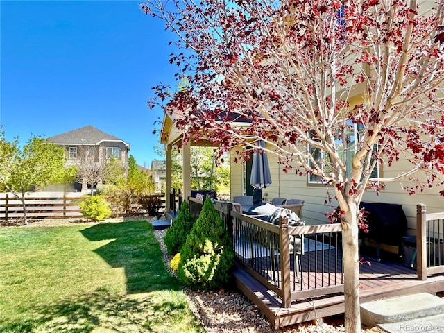 view of yard with a wooden deck